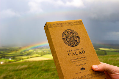 Ceremonial Cacao bar with a rainbow and landscape in the background